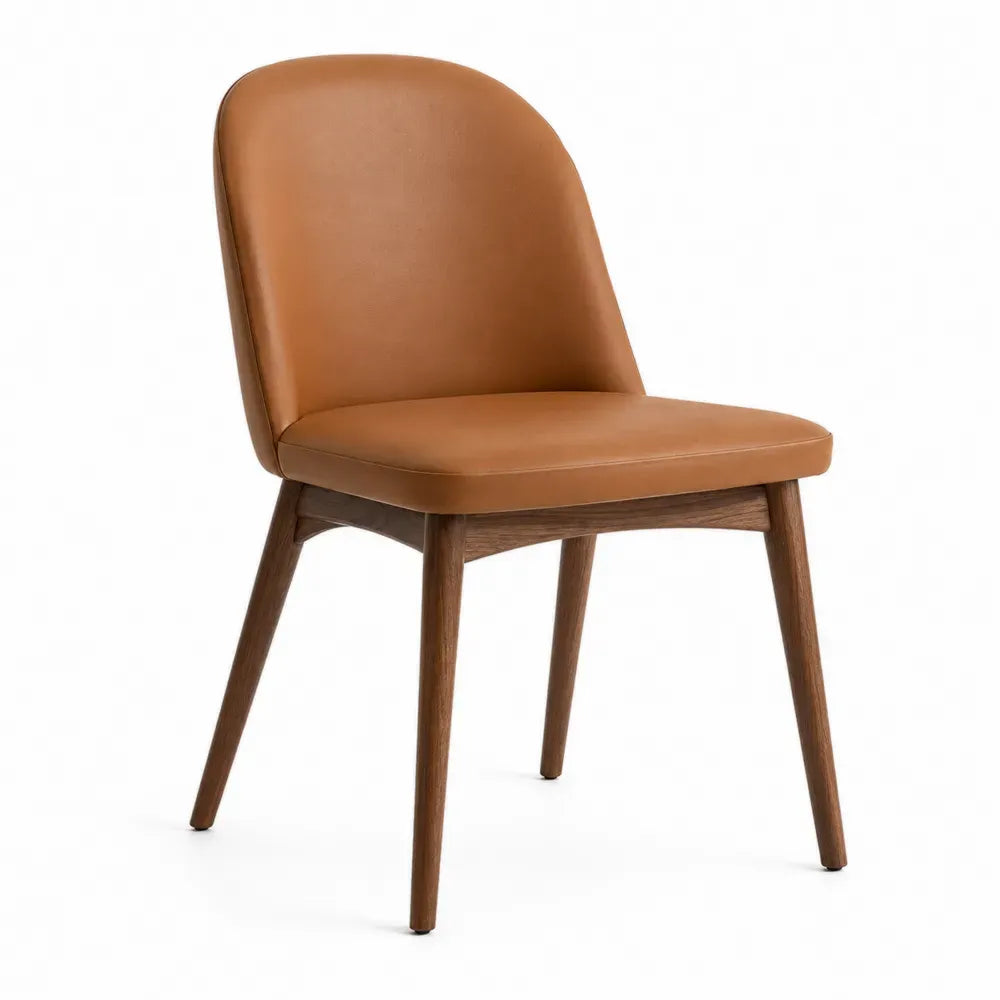 Silla de comedor tapizada en PU marrón coñac con respaldo curvado y patas de madera de caucho 48 x 52 x 84 cm