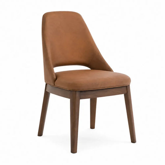 Silla de comedor tapizada en PU marrón coñac con respaldo alto curvado y patas de madera de caucho 48 x 55 x 85 cm